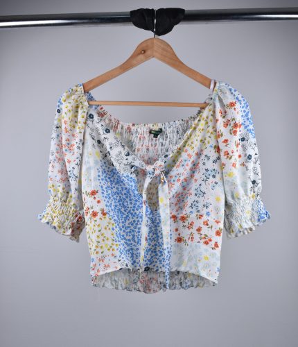 Blusa de dama con espalda multi-agujas